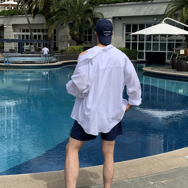 Elegantes pantalones cortos de verano oversize para hombre con bolsillos y cuello redondo