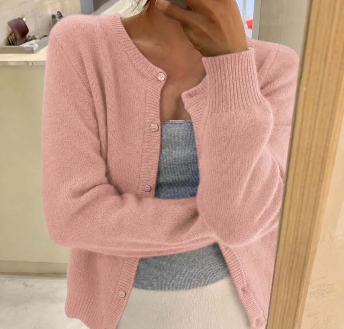 Soft knitted cardigan for women with button closure and round neck