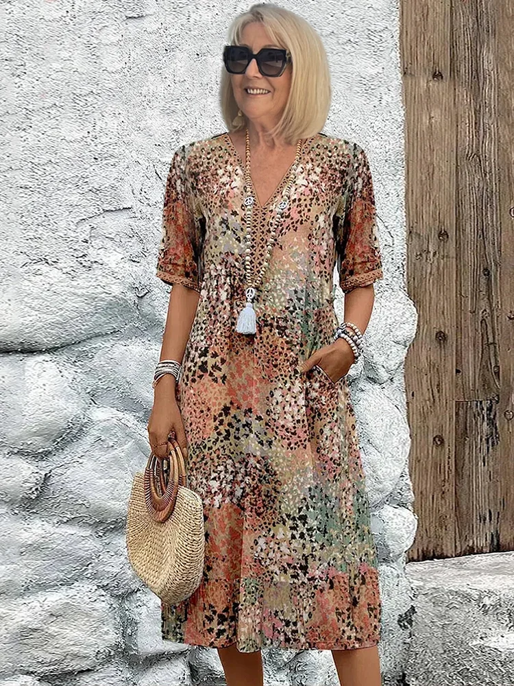 Blomstret midikjole i bohemian stil med knapper og V-udskæring – Let og luftig sommerkjole med trekvartærmer til hverdag
