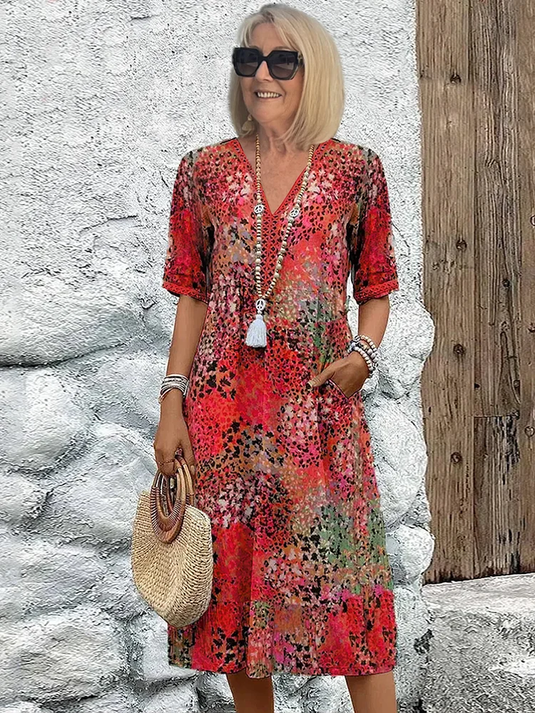 Blomstret midikjole i bohemian stil med knapper og V-udskæring – Let og luftig sommerkjole med trekvartærmer til hverdag