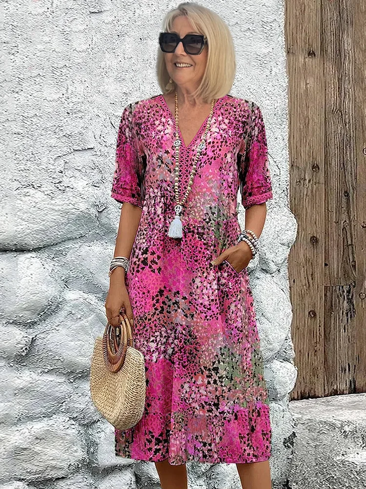 Blomstret midikjole i bohemian stil med knapper og V-udskæring – Let og luftig sommerkjole med trekvartærmer til hverdag