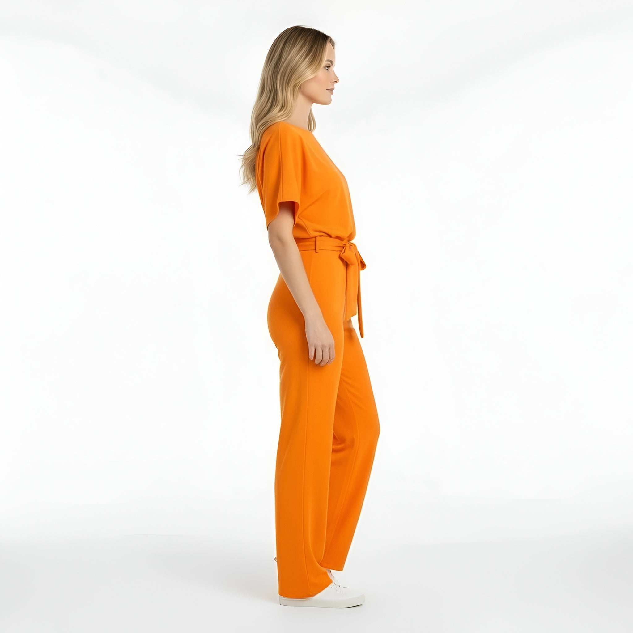 Dámsky overal s krátkym rukávom, opaskom, voľným strihom, dlhé nohavice, ležérny overal