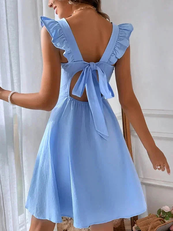 Robe courte évasée à volants, bretelles ajustables, en coton léger, parfaite pour l'été, disponible en plusieurs couleurs.