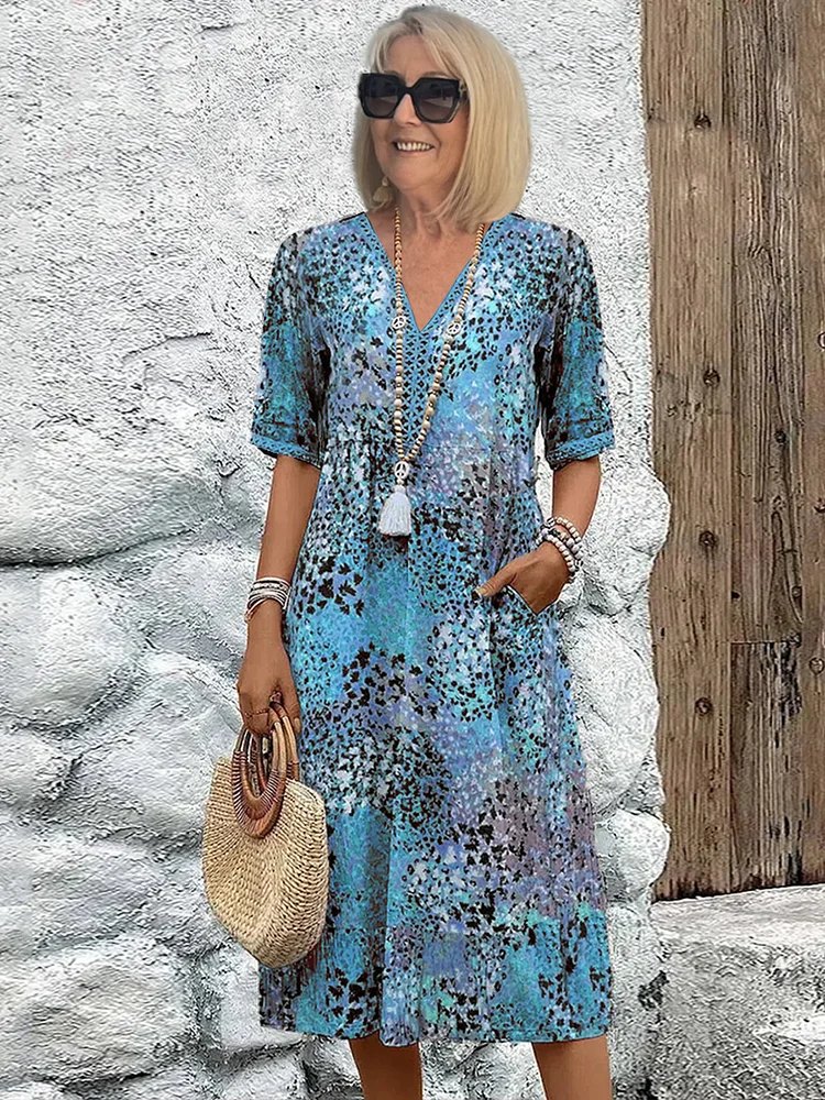 Blomstret midikjole i bohemian stil med knapper og V-udskæring – Let og luftig sommerkjole med trekvartærmer til hverdag