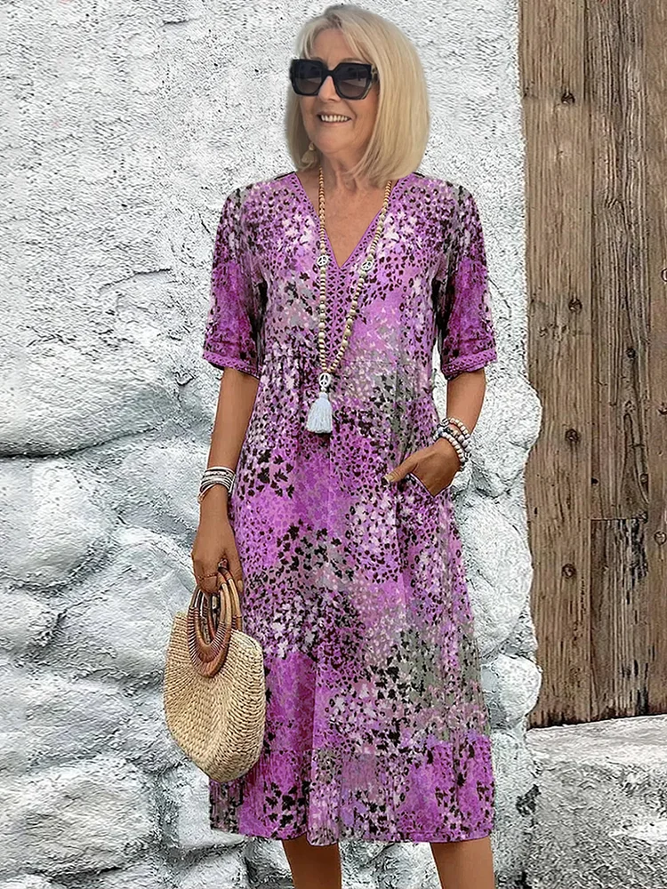 Blomstret midikjole i bohemian stil med knapper og V-udskæring – Let og luftig sommerkjole med trekvartærmer til hverdag