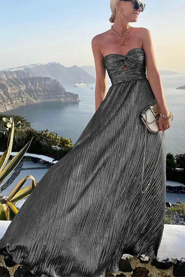 Robe longue bustier brillante avec nœud, en tissu léger, idéale pour les soirées, offrant une silhouette élégante et fluide.