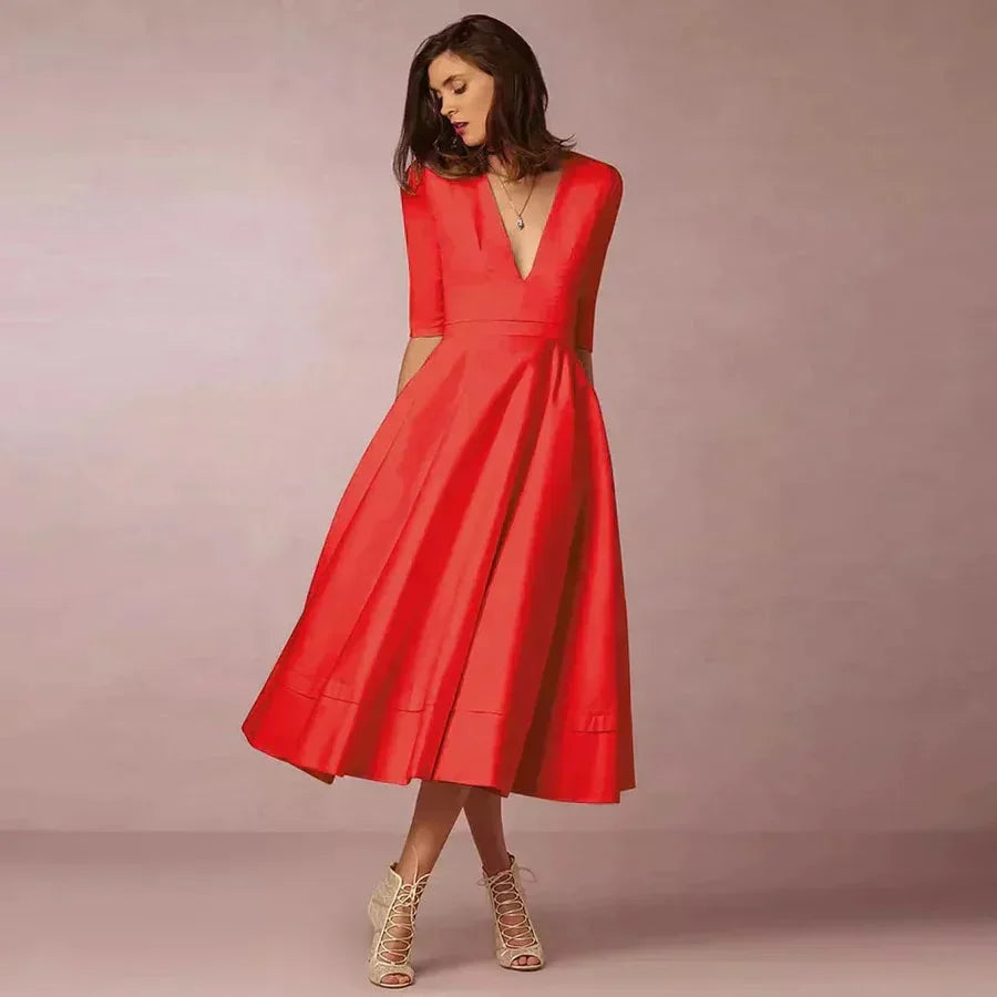 Robe midi évasée en tissu lisse, col en V, manches 3/4, avec poches pratiques, idéale pour les mariages.
