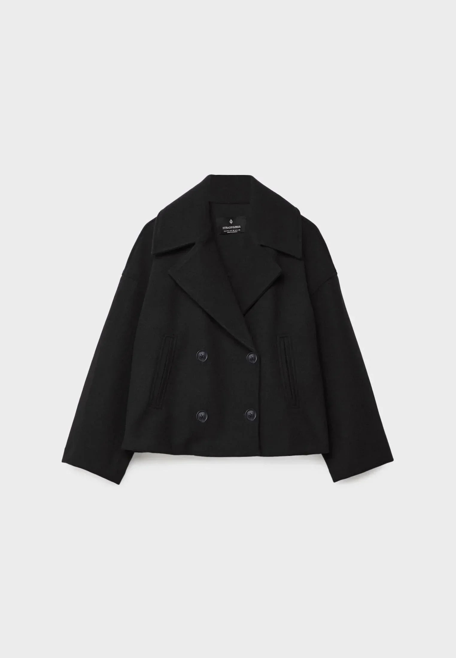 Veste femme courte beige à double boutonnage en mélange de coton, adaptée pour des occasions décontractées.